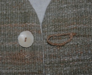 Button made from a shell on the homegrown, handspun cotton vest.